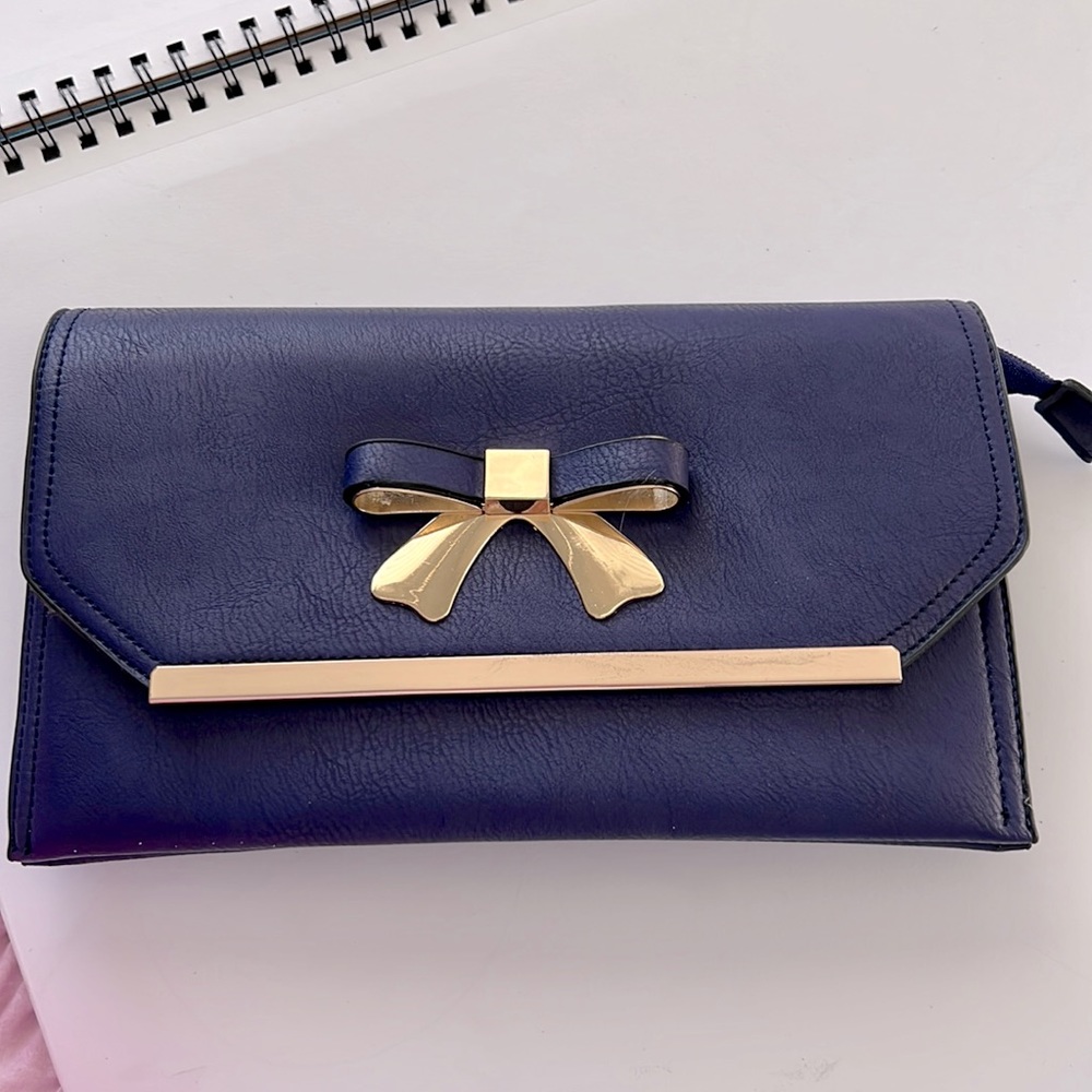 Dark purple/bluish clutch with shoulder and wrist straps